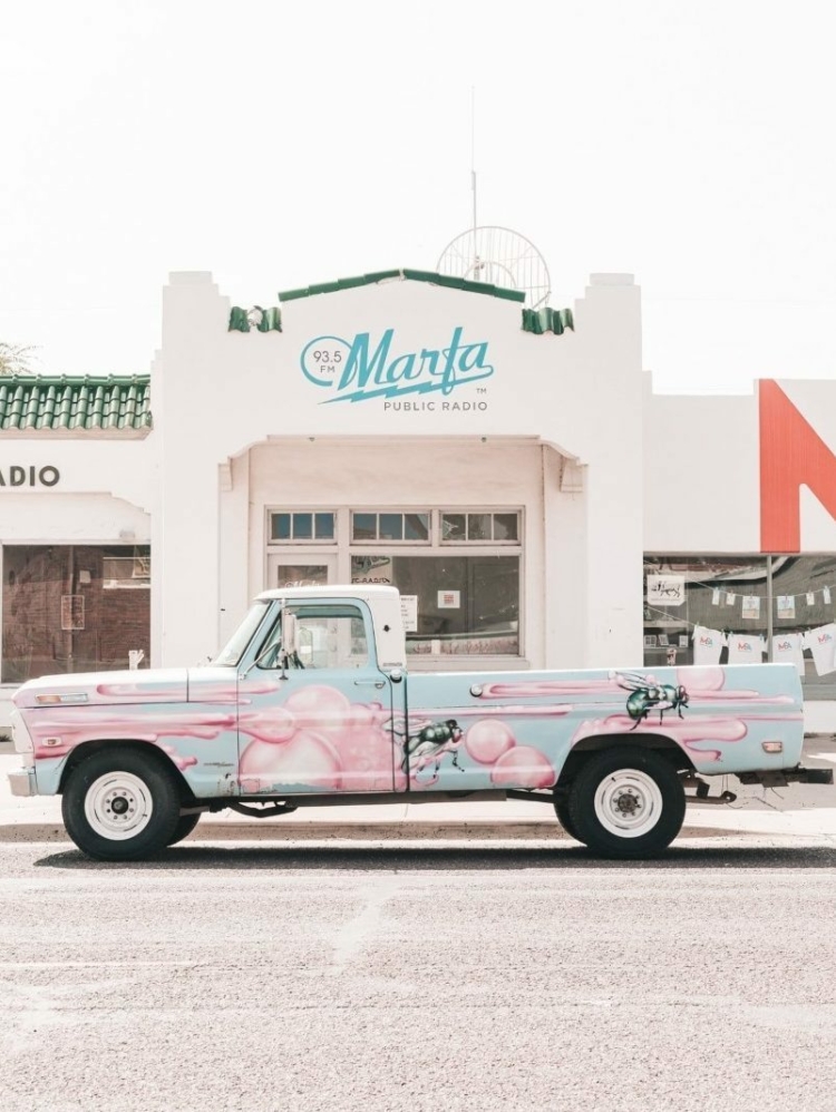 A colourful truck parked in front of the building of Marfa Public Radio in Texas.